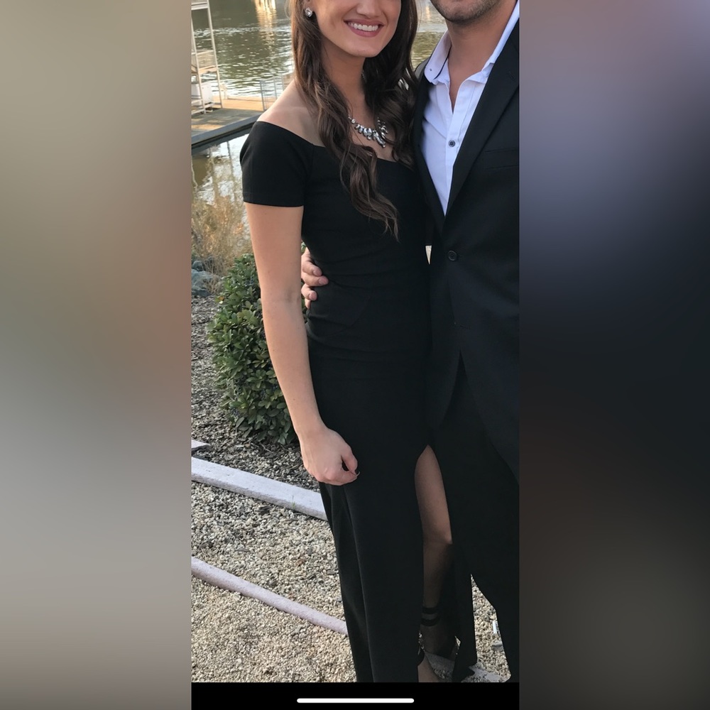 Black dress worn once to wedding. Flattering fit/comfortable. High center slit.